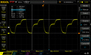 Oscilloscope screen with waveform visible