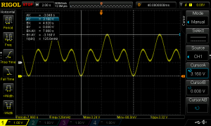 Oscilloscope screen with waveform visible